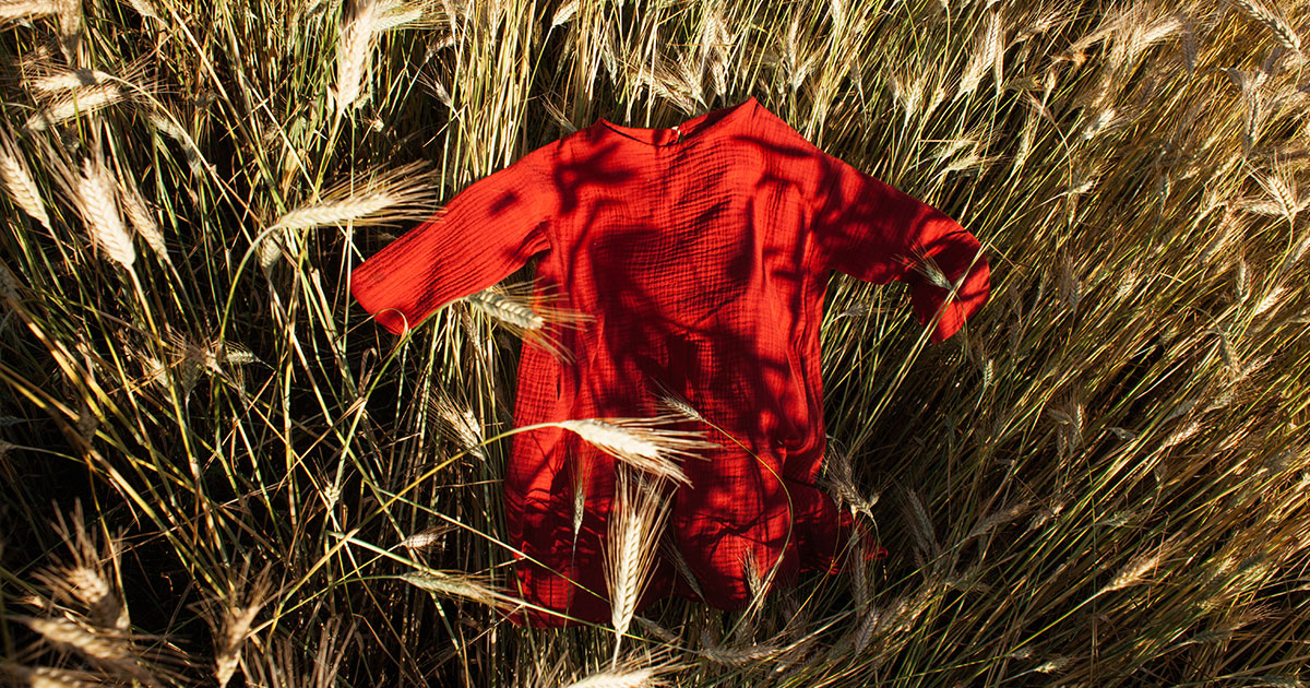 Red dress in rye field