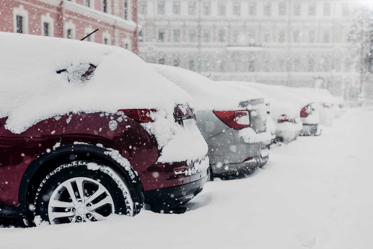 parked cars stuck in snow
